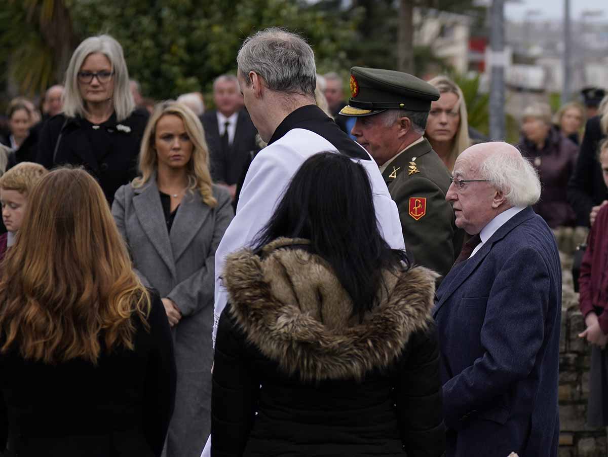 President Michael D Higgins pays tribute at the funeral of James Flaherty